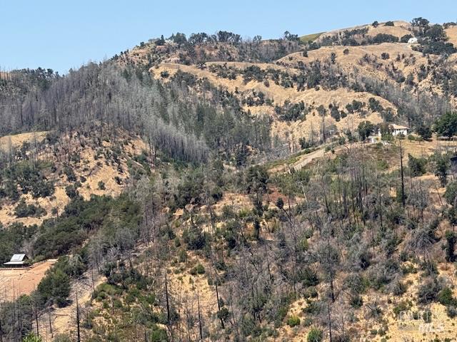 6300 Wildwood Mountain Road Santa Rosa, CA 95409 - Photo 15 of 28 a view of a large building with mountains in the background