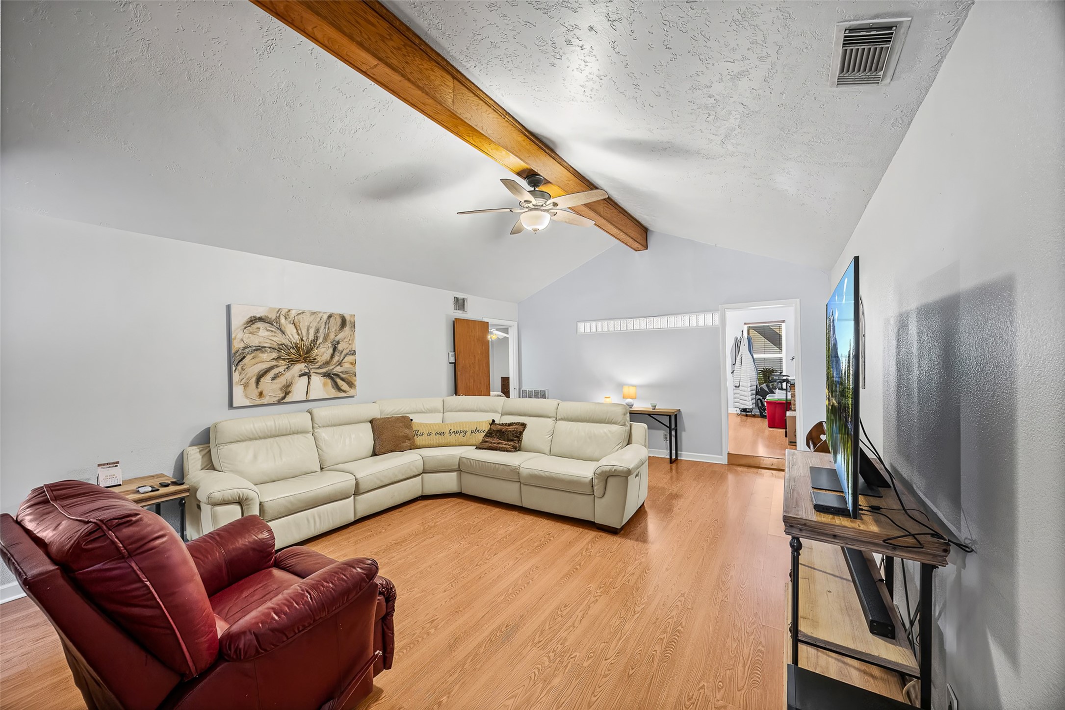 2519 Wood River Road Spring, TX 77373 - Photo 7 of 26 a living room with furniture and a flat screen tv