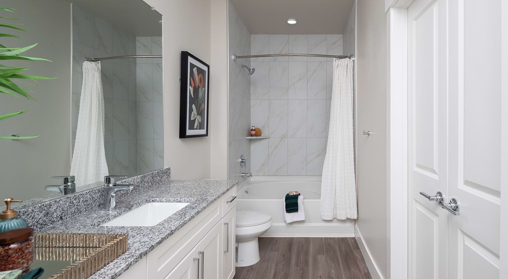 2425 Bell Street, Unit 2220 Houston, TX 77003 - Photo 8 of 30 a bathroom with a granite countertop sink toilet and shower