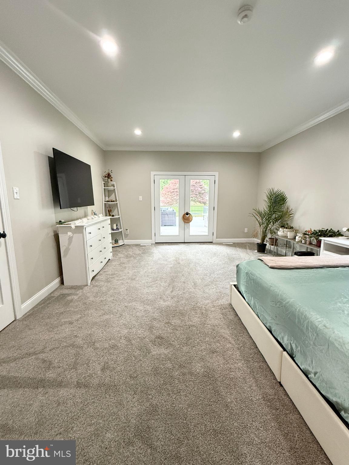 821 Burrows Run Road Chadds Ford, PA 19317 - Photo 107 of 146 a large bedroom with a large bed and a flat screen tv