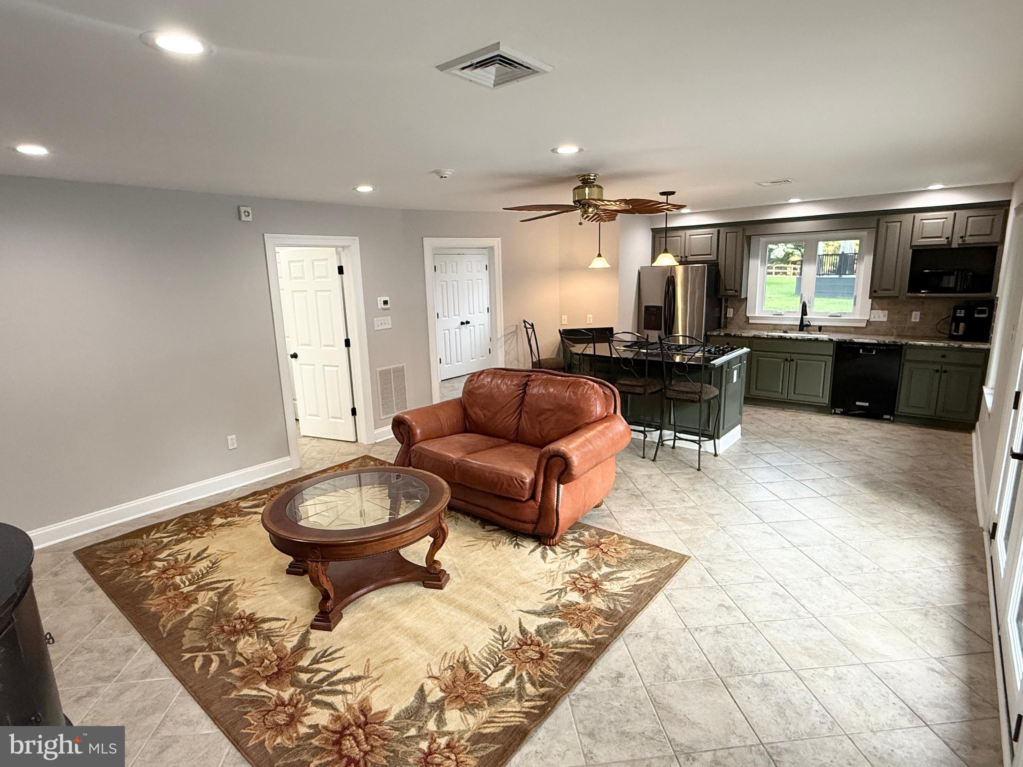821 Burrows Run Road Chadds Ford, PA 19317 - Photo 114 of 146 a living room with furniture and a wooden floor