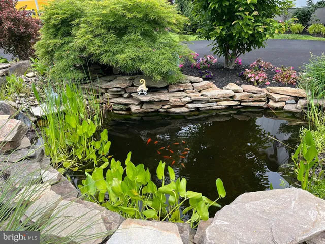 a living room with a fireplace and a flat screen tv