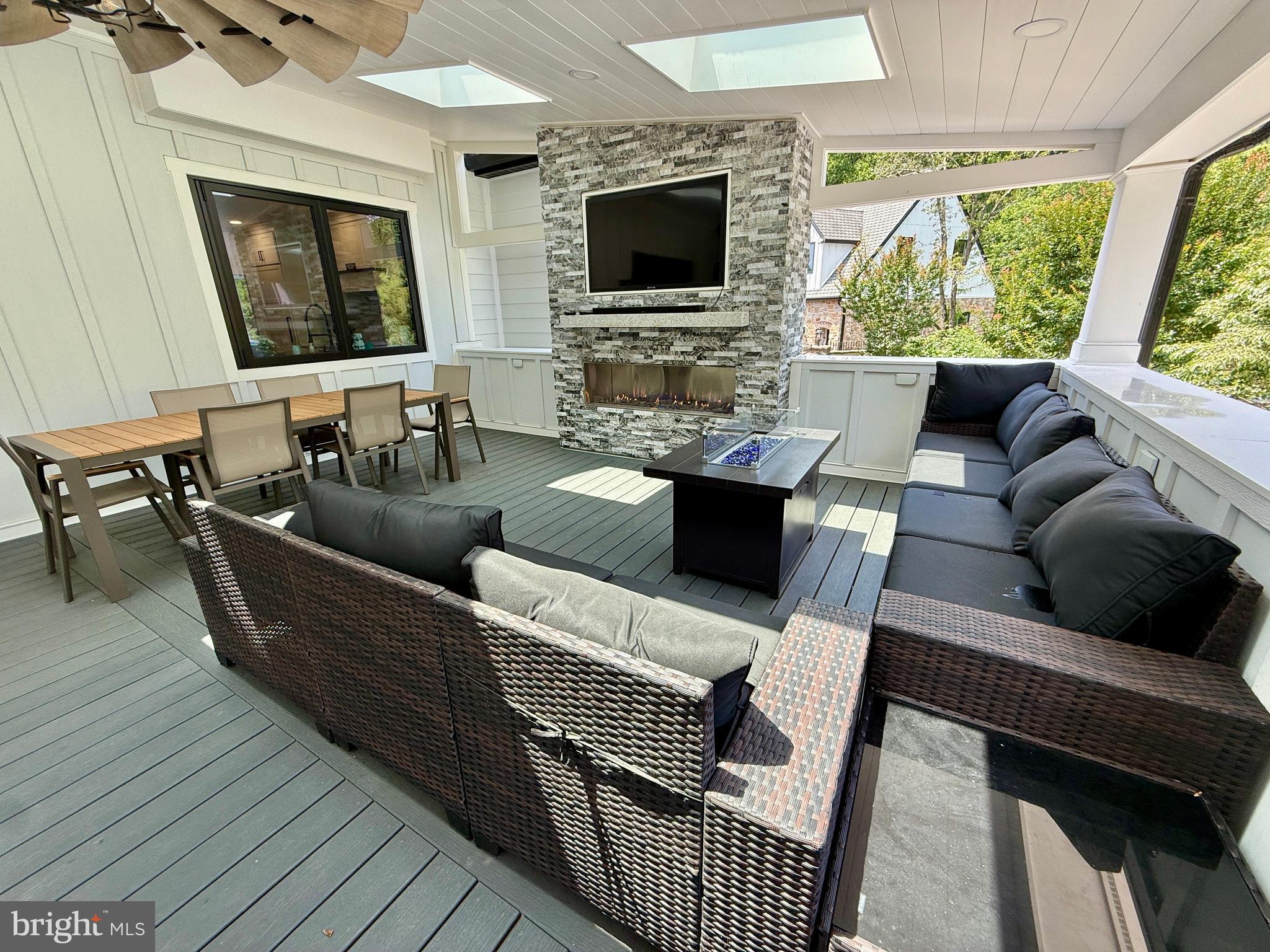 821 Burrows Run Road Chadds Ford, PA 19317 - Photo 130 of 146 a living room with furniture and a flat screen tv