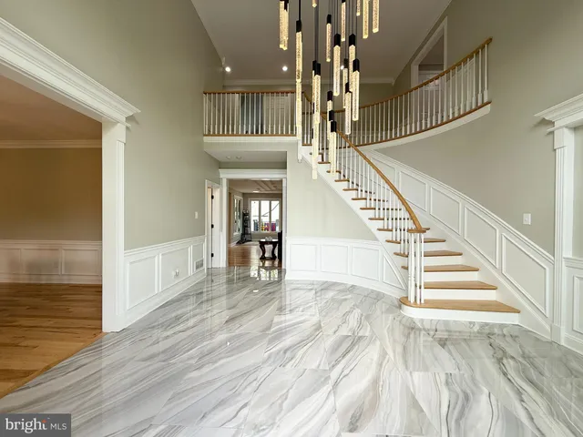 a living room with fireplace furniture and a wooden floor