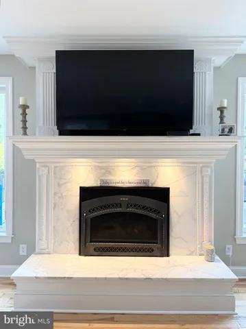 a bathroom with a sink a large mirror and a shower