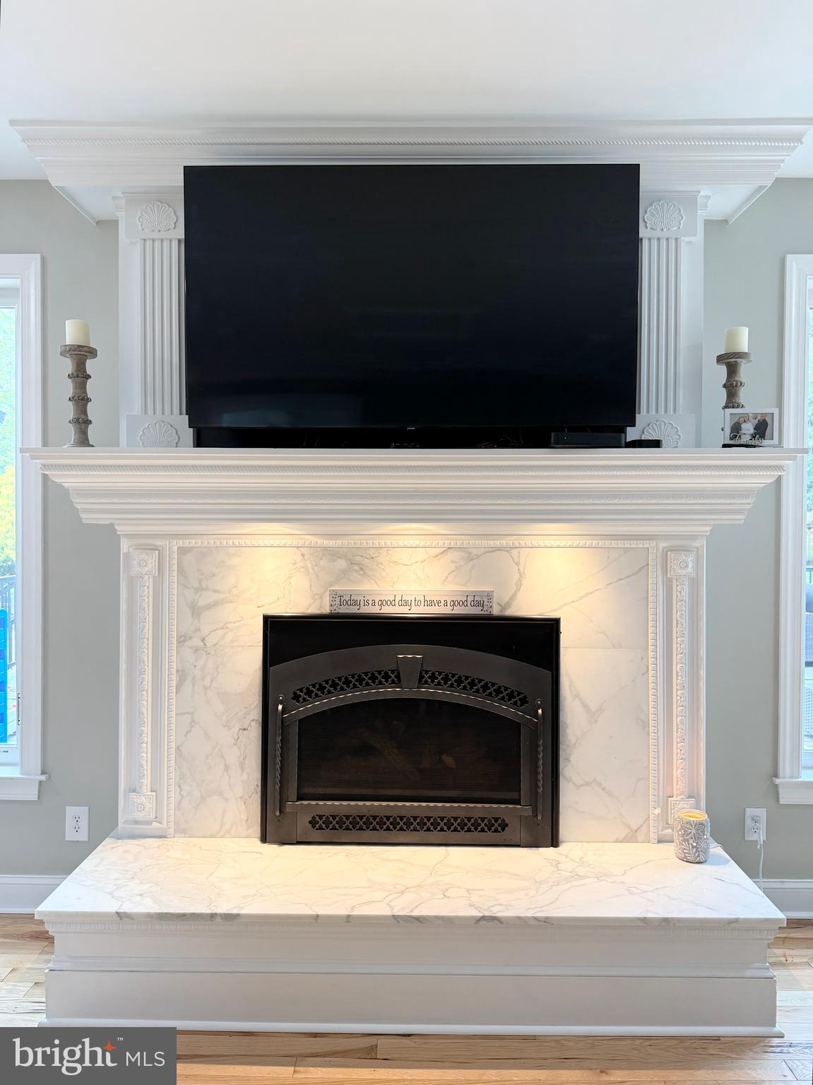 821 Burrows Run Road Chadds Ford, PA 19317 - Photo 28 of 146 a living room with a fireplace and a flat screen tv