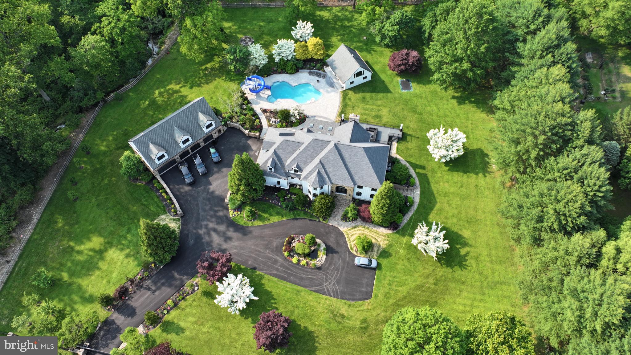 821 Burrows Run Road Chadds Ford, PA 19317 - Photo 3 of 146 an aerial view of a house with outdoor space pool seating area and yard