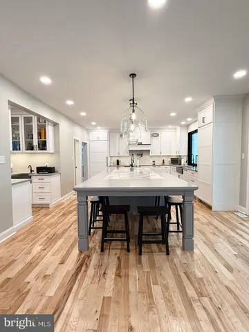 a view of empty room with a fireplace and a window