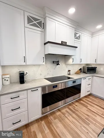 a living room with furniture and stairs