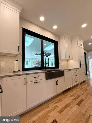 a bathroom with a shower and a bath tub