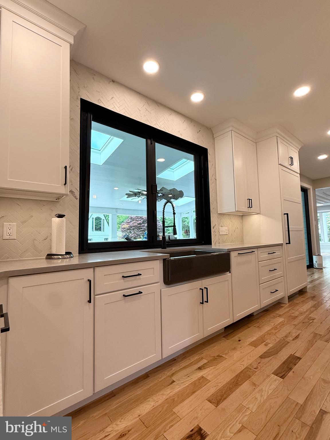 821 Burrows Run Road Chadds Ford, PA 19317 - Photo 39 of 146 a kitchen with granite countertop white cabinets and white appliances