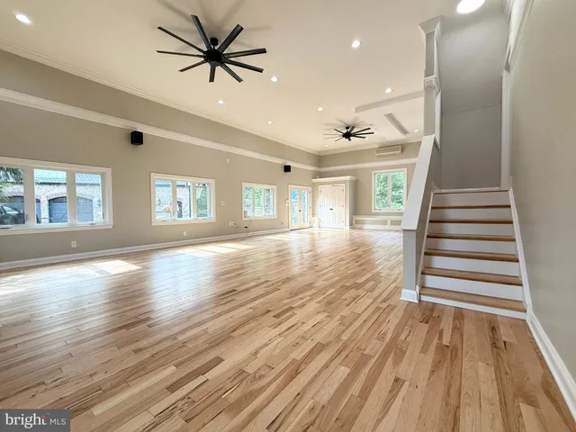 a view of a house with pool deck and couches