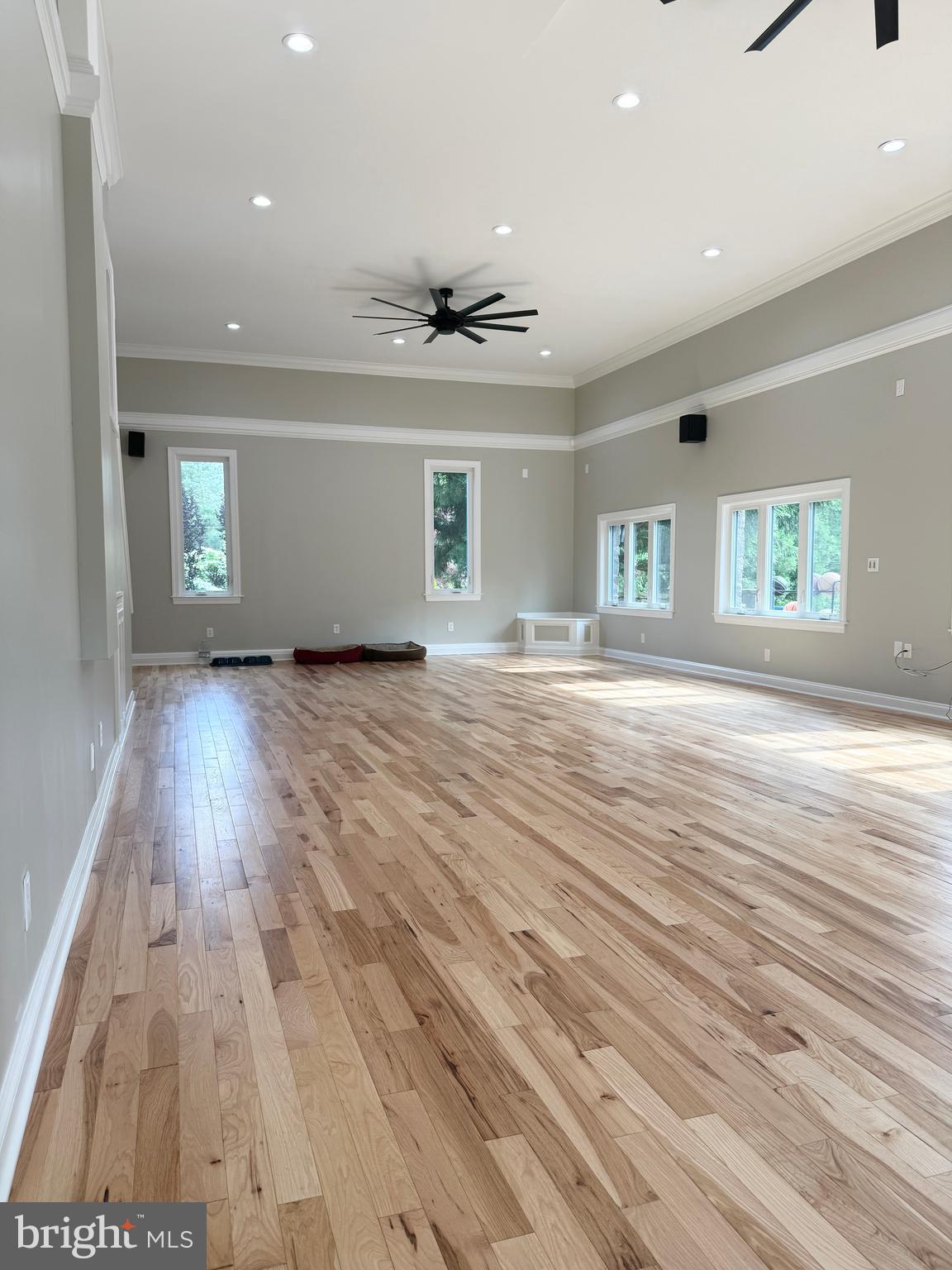 821 Burrows Run Road Chadds Ford, PA 19317 - Photo 53 of 146 an empty room with wooden floor and windows