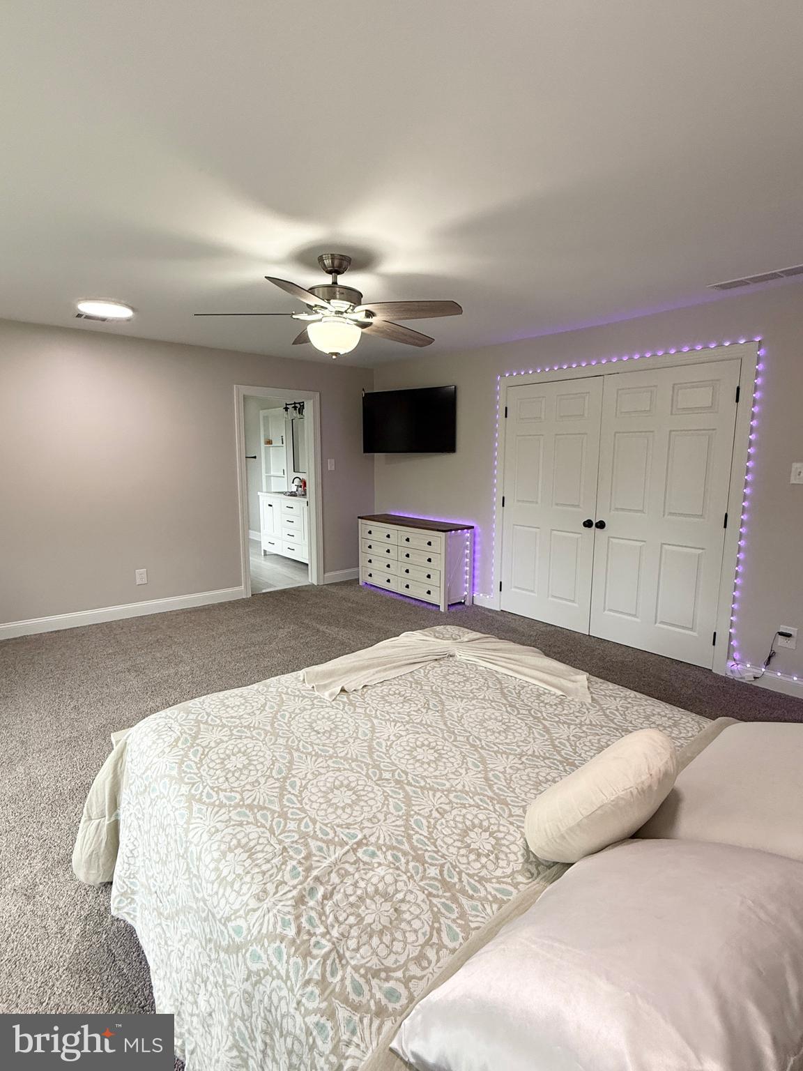 821 Burrows Run Road Chadds Ford, PA 19317 - Photo 70 of 146 a bedroom with a large bed and a chandelier