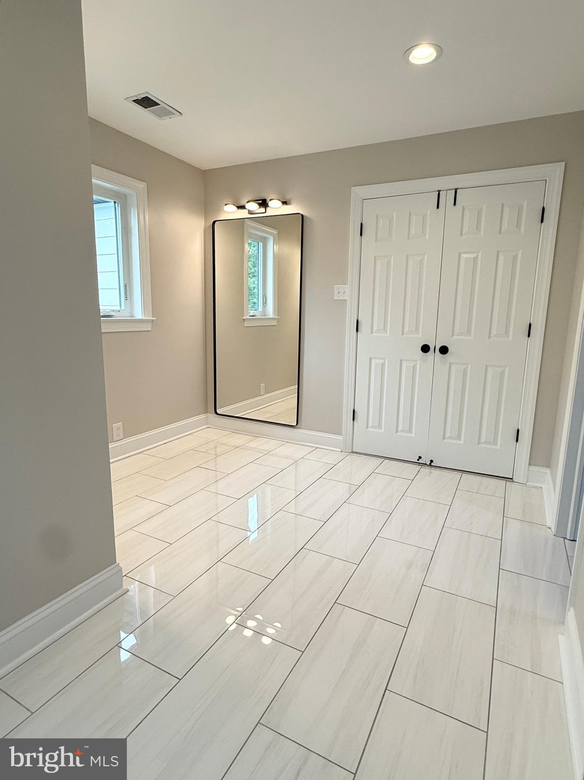 821 Burrows Run Road Chadds Ford, PA 19317 - Photo 89 of 146 a view of an empty room with window and wooden floor