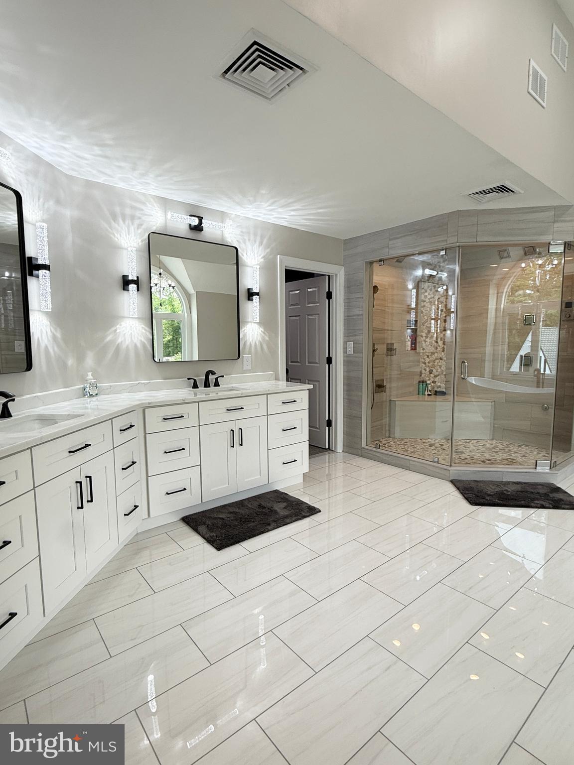 821 Burrows Run Road Chadds Ford, PA 19317 - Photo 91 of 146 a spacious bathroom with a granite countertop sink a toilet a mirror and shower