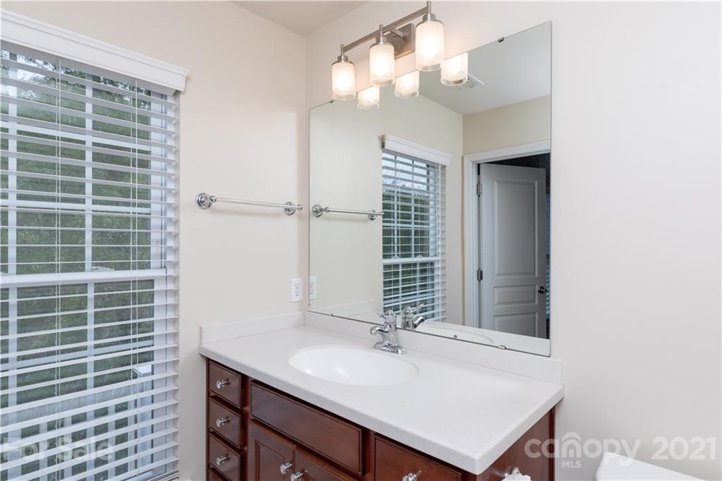 623 6th Baxter Crossing Fort Mill, SC 29708 - Photo 15 of 27 a bathroom with a sink vanity and a mirror