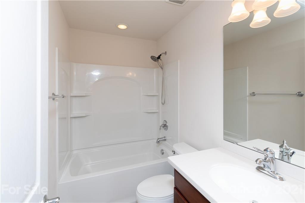 623 6th Baxter Crossing Fort Mill, SC 29708 - Photo 18 of 27 a bathroom with a sink toilet and shower