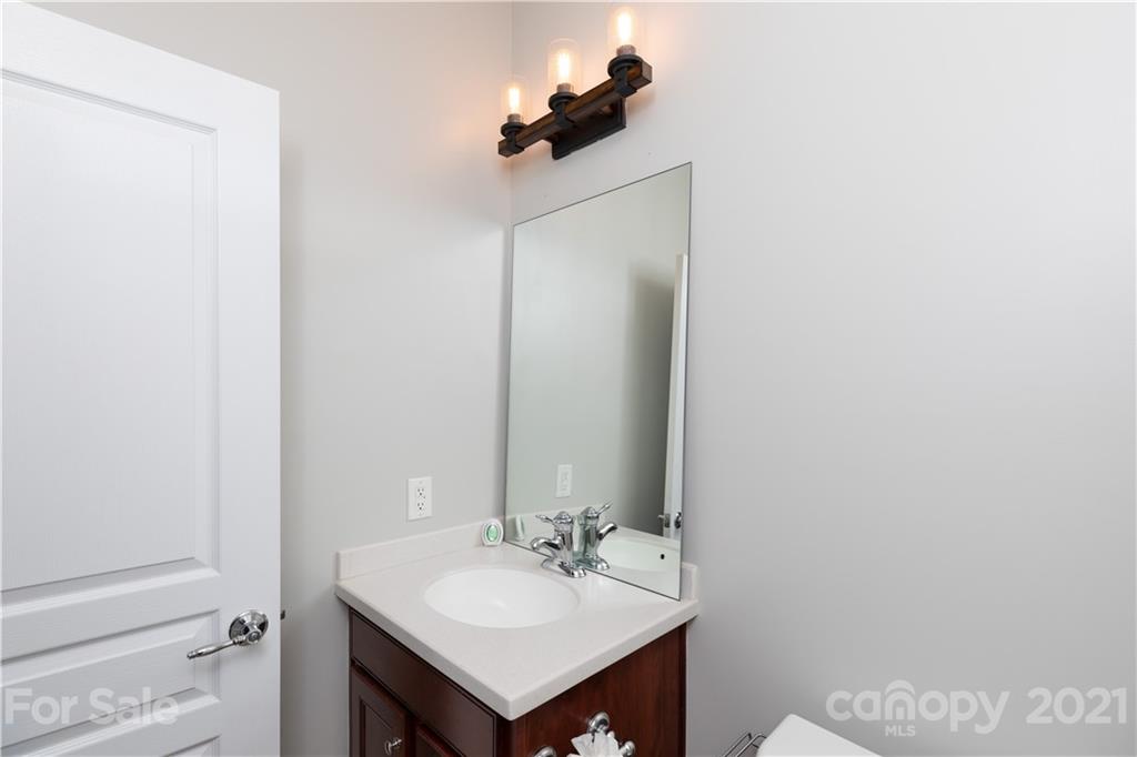 623 6th Baxter Crossing Fort Mill, SC 29708 - Photo 22 of 27 a bathroom with a sink and a mirror