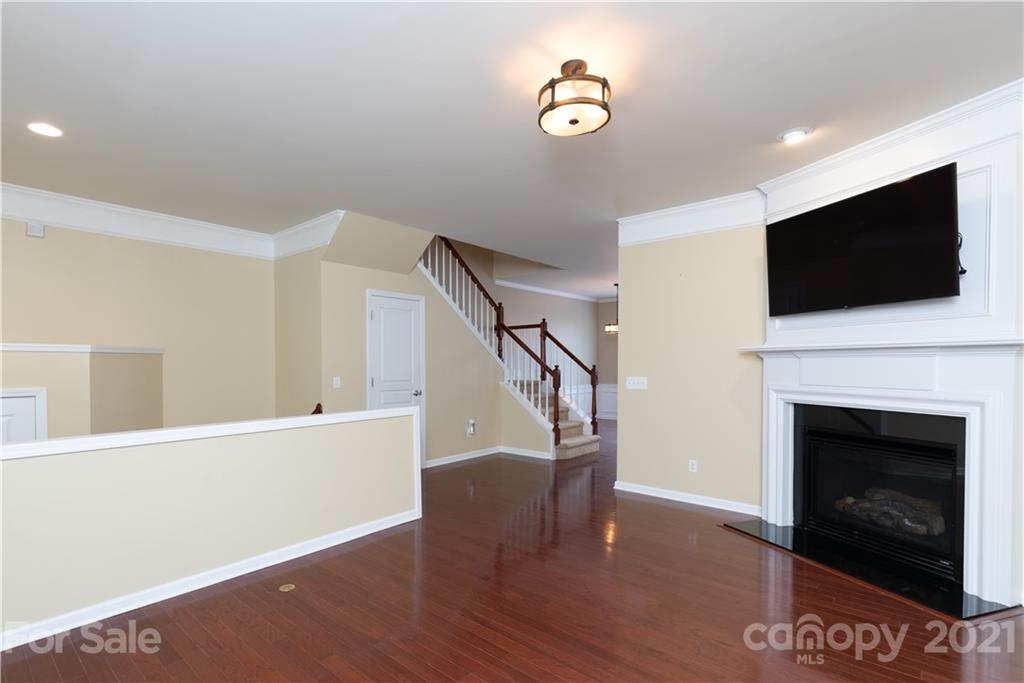 623 6th Baxter Crossing Fort Mill, SC 29708 - Photo 8 of 27 a view of a livingroom with furniture and a fireplace