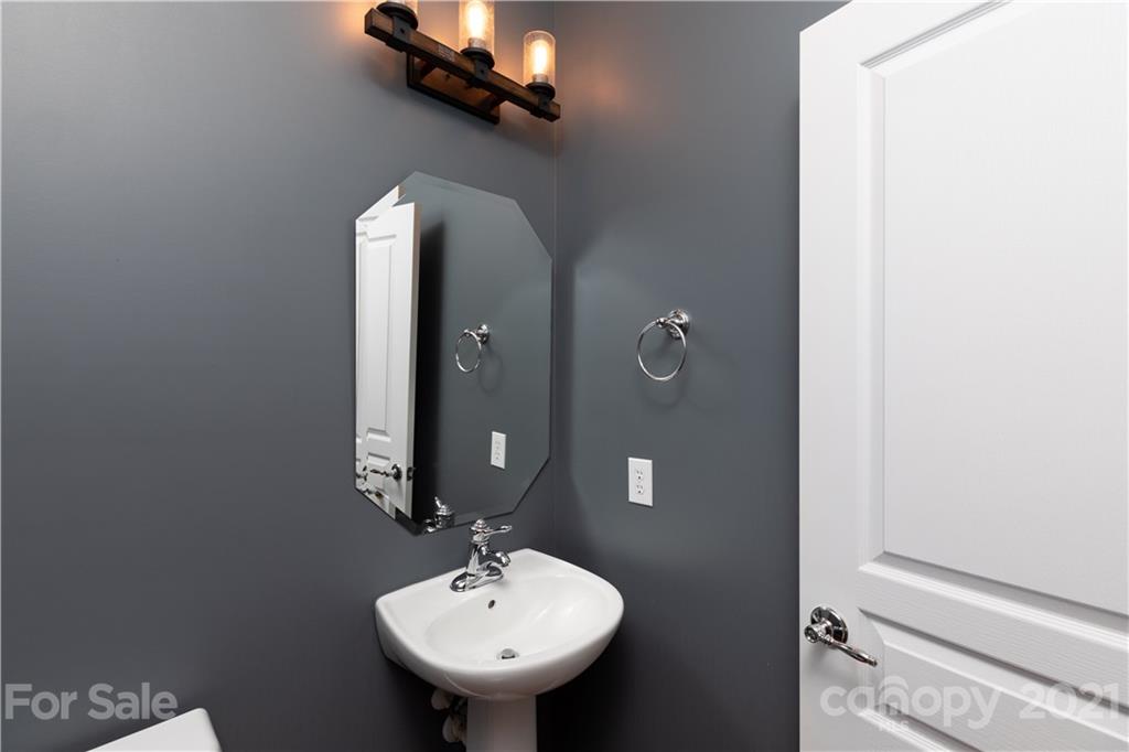623 6th Baxter Crossing Fort Mill, SC 29708 - Photo 10 of 27 a bathroom with a sink and a mirror