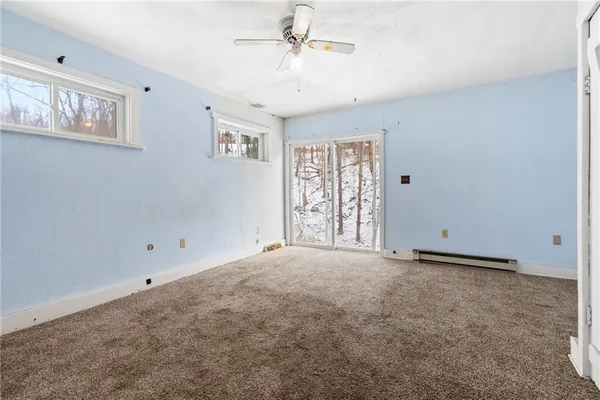 a view of an empty room with a window