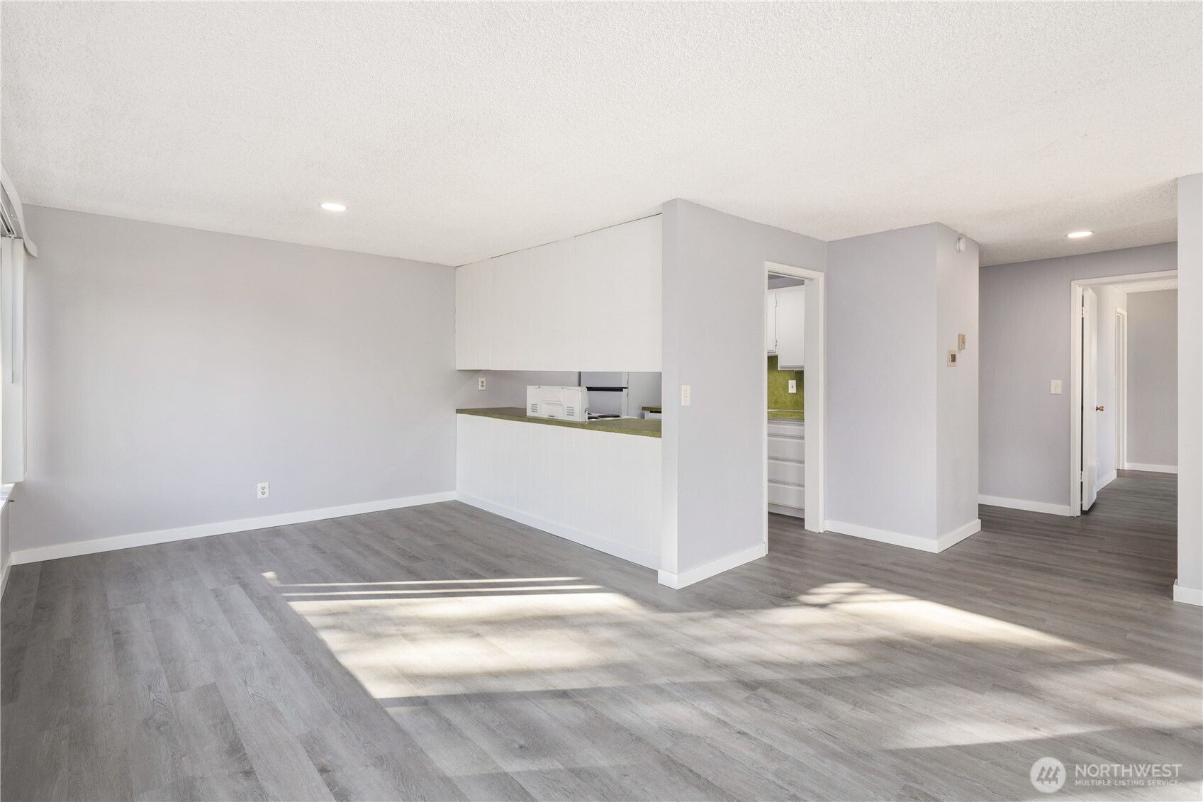 3600 25th Avenue West Seattle, WA 98199 - Photo 17 of 30 a view of empty room with wooden floor