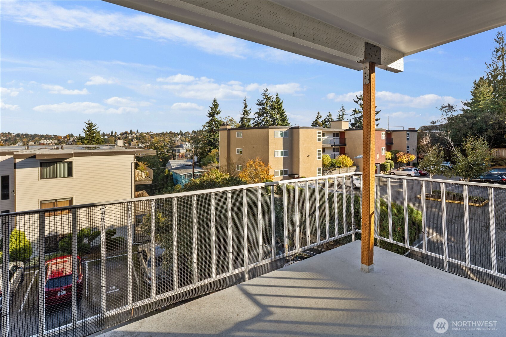 3600 25th Avenue West Seattle, WA 98199 - Photo 22 of 30 a view of a balcony with wooden floor and iron stairs