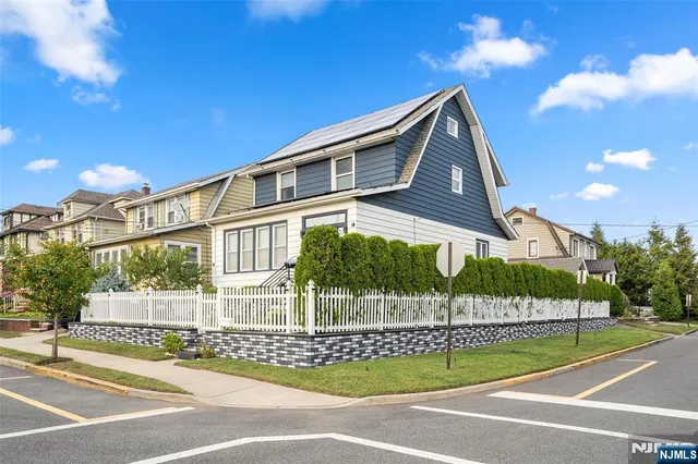 a view of a house with a street