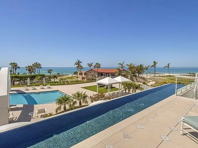 a view of swimming pool with outdoor seating