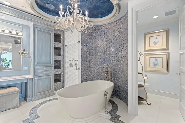 a bathroom with a bathtub a sink and a mirror