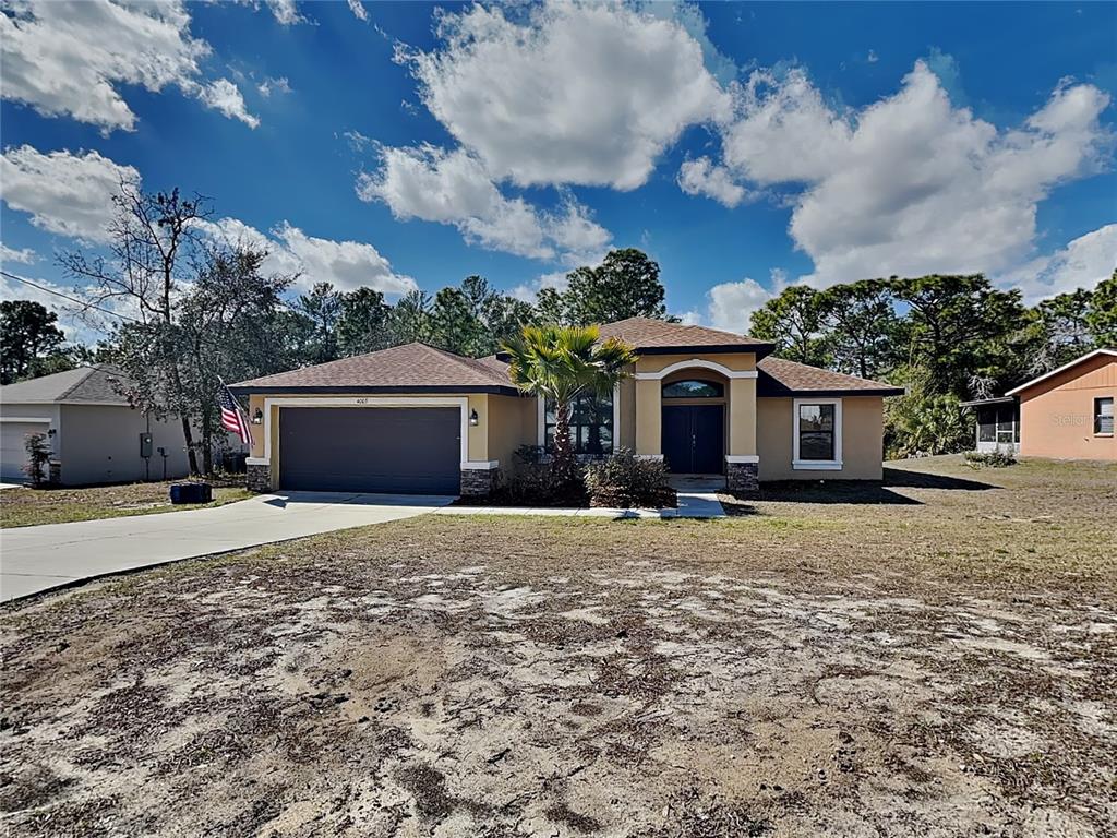 Undisclosed Address Spring Hill, FL 34609 - Photo 1 of 1 a front view of a house with garden