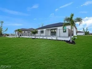 a front view of house with yard and green space