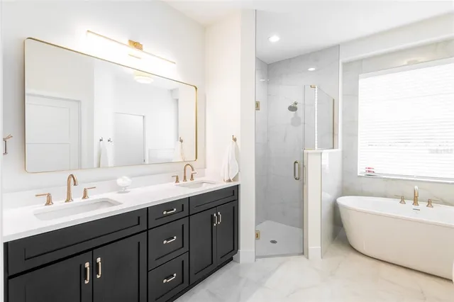 a white bath tub sitting next to a window