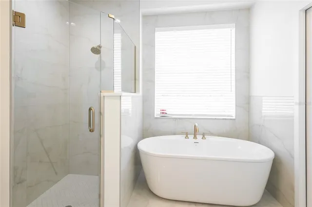 a white toilet sitting next to a white sink