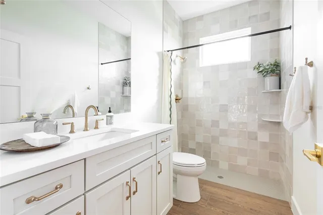 a living room with a bed furniture and a large window