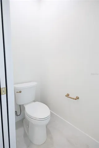 a living room with a bed furniture and a window