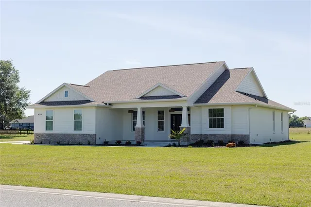 a front view of a house with yard