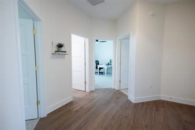 a view of a living room with a wooden floor