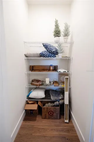 a kitchen with a sink cabinets and a window