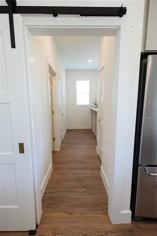 a large white kitchen with a sink