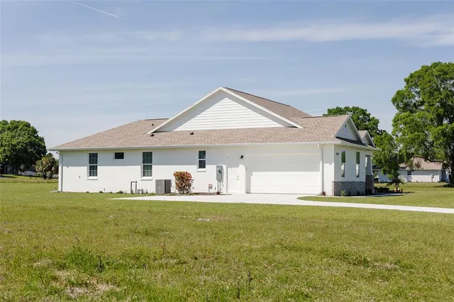 a big house with a big yard and more windows