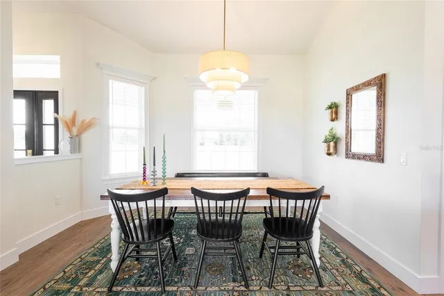 a dining room with furniture and window