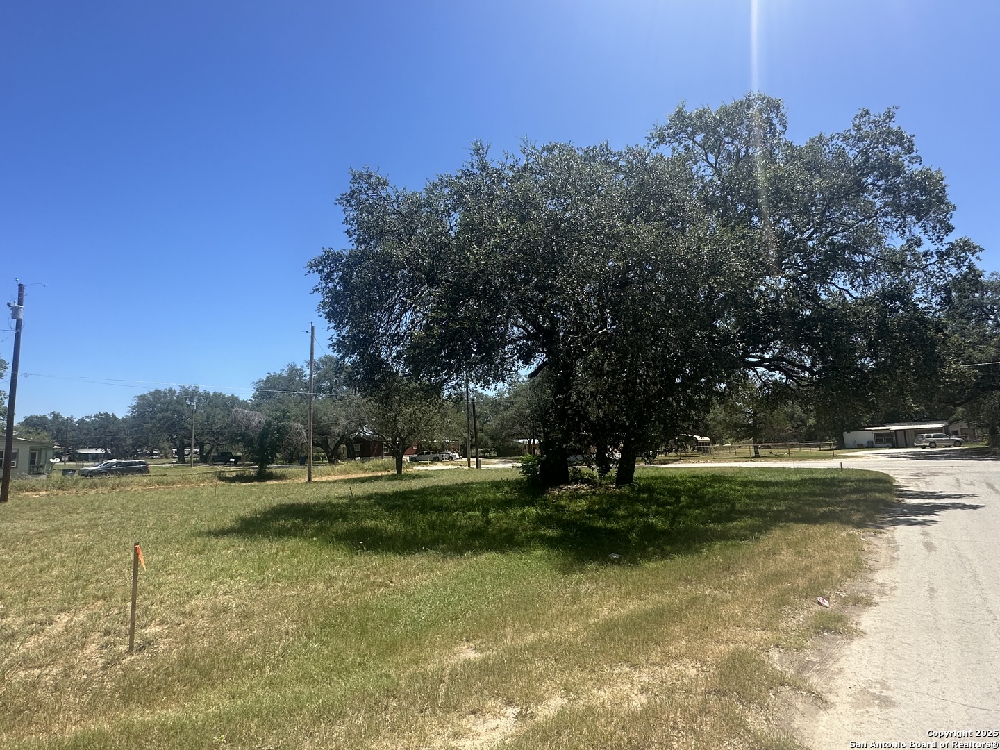 a view of outdoor space with green field and trees