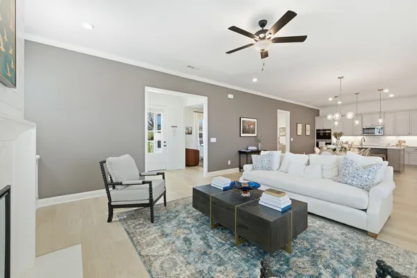 a living room with furniture and white walls