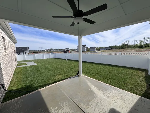 a view of a water fountain and a big yard