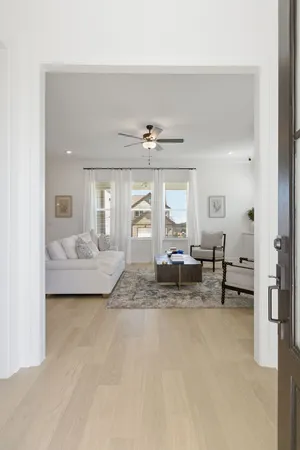 a living room with furniture and white walls