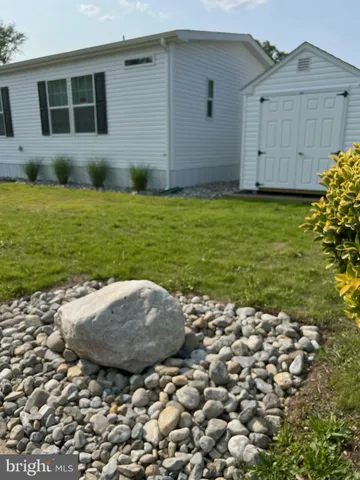 a view of a backyard with a garden and plants