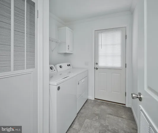 a view of utility room with closet
