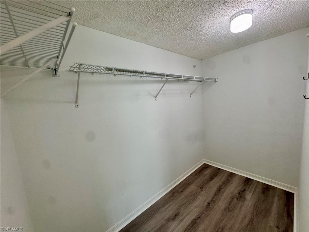 661 Squire Circle, Unit 101 Naples, FL 34104 - Photo 8 of 25 a view of a room with racks on the wall